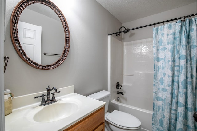 full bathroom featuring a textured ceiling, shower / tub combo, vanity, and toilet