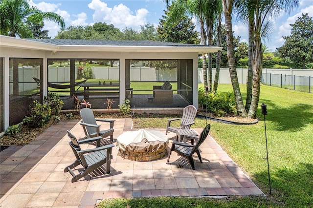 view of patio featuring an outdoor fire pit and a fenced backyard