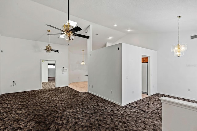 spare room featuring ceiling fan with notable chandelier, high vaulted ceiling, and light carpet