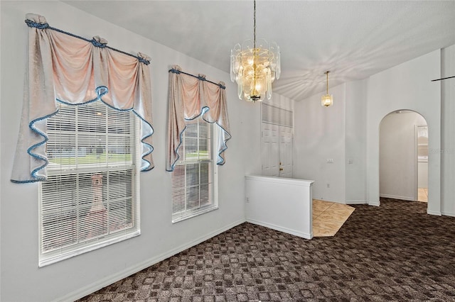 unfurnished dining area with carpet flooring and an inviting chandelier