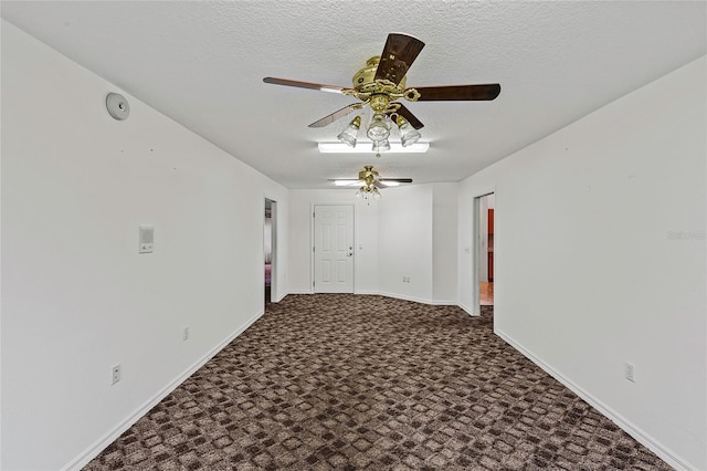 carpeted empty room featuring a textured ceiling and ceiling fan