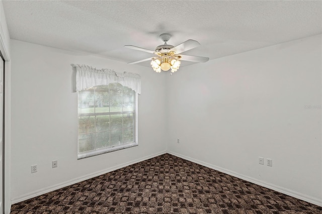 spare room featuring ceiling fan and a textured ceiling