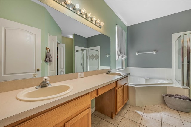 bathroom featuring tile patterned flooring, vanity, separate shower and tub, and lofted ceiling