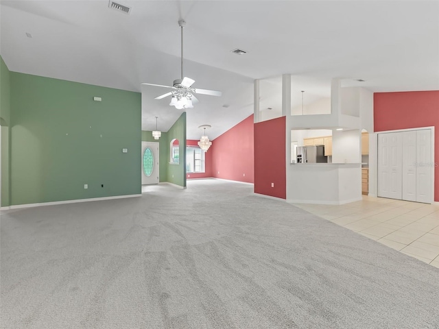 unfurnished living room featuring ceiling fan, high vaulted ceiling, and light colored carpet