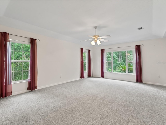 unfurnished room featuring ceiling fan and carpet flooring