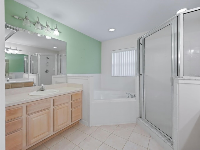 bathroom featuring tile patterned flooring, plus walk in shower, and vanity