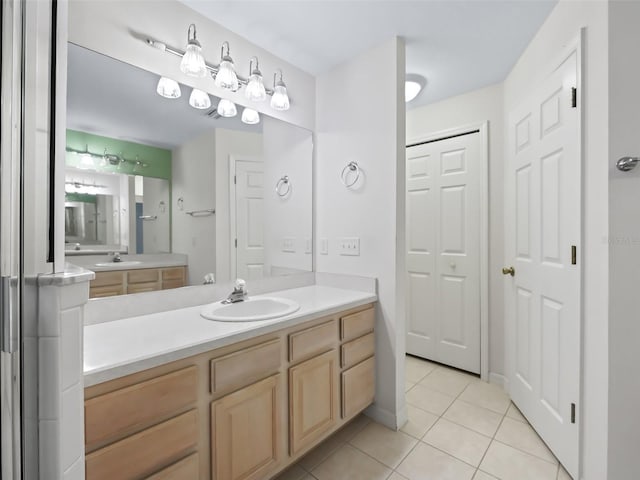 bathroom featuring tile patterned floors and vanity