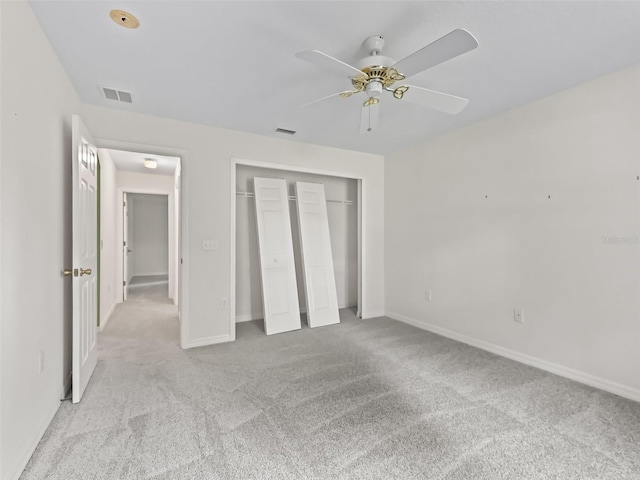 unfurnished bedroom featuring ceiling fan and light carpet