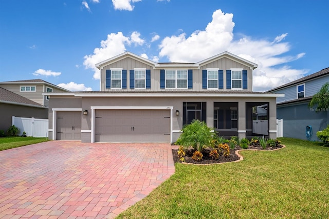 view of front of house featuring a garage and a front yard