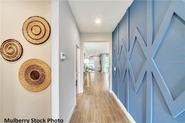 hall with light hardwood / wood-style flooring