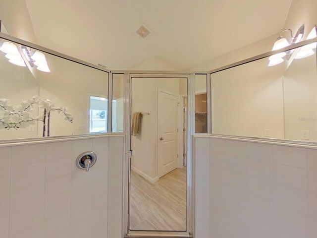 bathroom with hardwood / wood-style floors