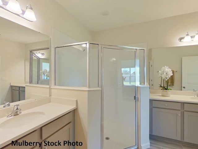 bathroom featuring vanity and walk in shower