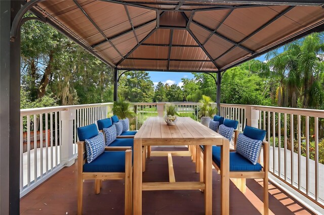 view of patio featuring outdoor lounge area, a deck, and a gazebo