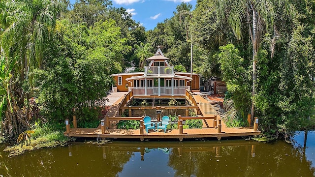 dock area featuring a deck with water view