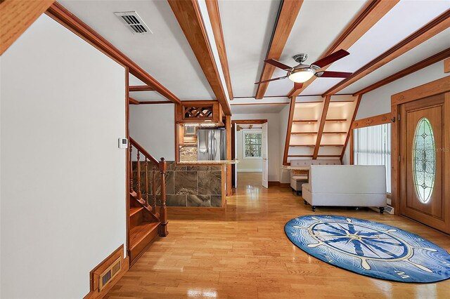 entrance foyer featuring ceiling fan and light wood-type flooring