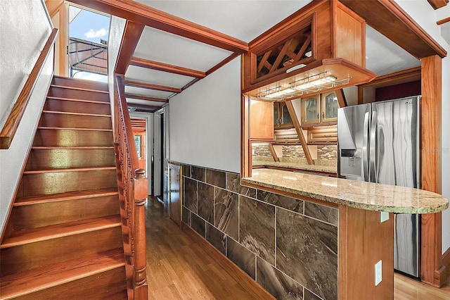 staircase featuring hardwood / wood-style flooring