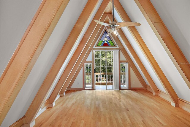 additional living space featuring ceiling fan, light hardwood / wood-style floors, and vaulted ceiling