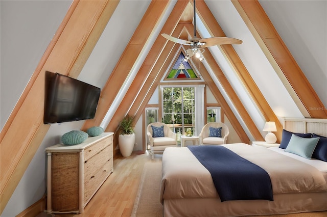 bedroom featuring ceiling fan, vaulted ceiling, and light hardwood / wood-style floors