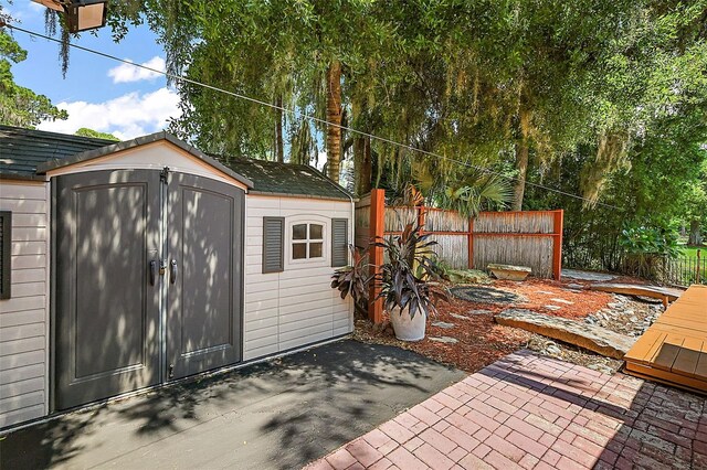 view of patio with a storage unit