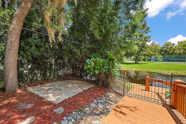 wooden terrace featuring a patio