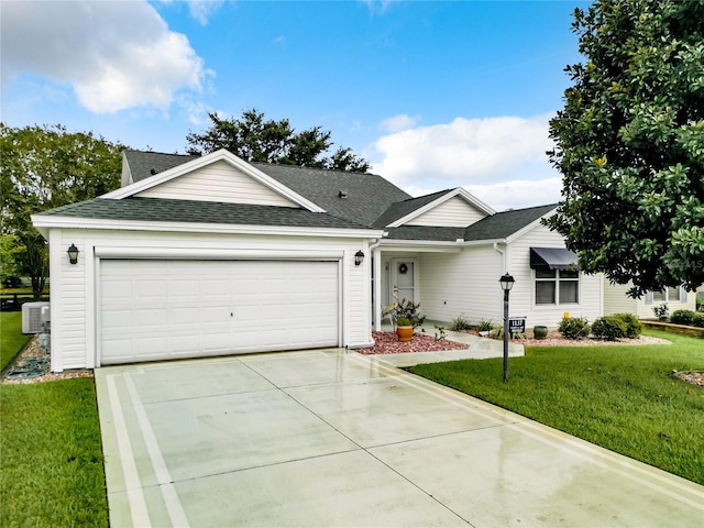 ranch-style home featuring a garage and a front yard