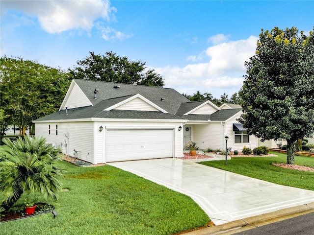 view of front of property featuring a garage and a front yard