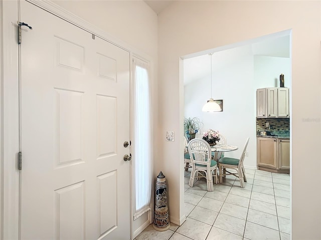 entryway with light tile patterned floors