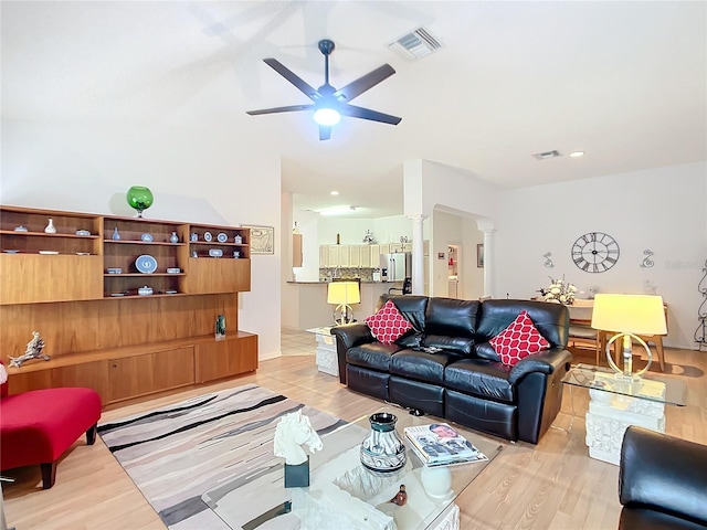 living room featuring light wood-type flooring and ceiling fan