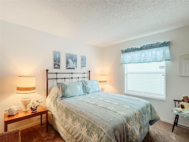 carpeted bedroom with a textured ceiling