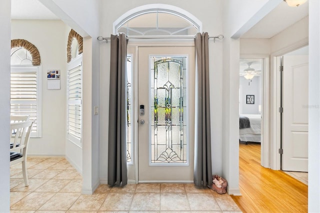 foyer featuring ceiling fan and light wood-type flooring