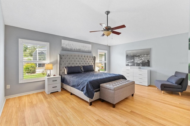 bedroom featuring ceiling fan and light wood-type flooring