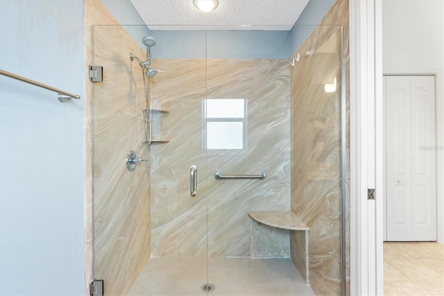 bathroom with tile patterned floors and a shower with shower door