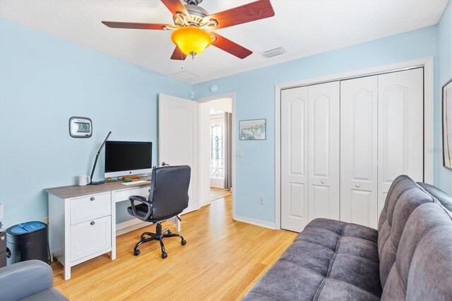 office area with ceiling fan and light wood-type flooring