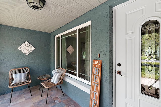 entrance to property featuring covered porch