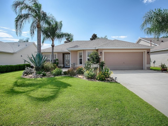 ranch-style house featuring a garage and a front yard