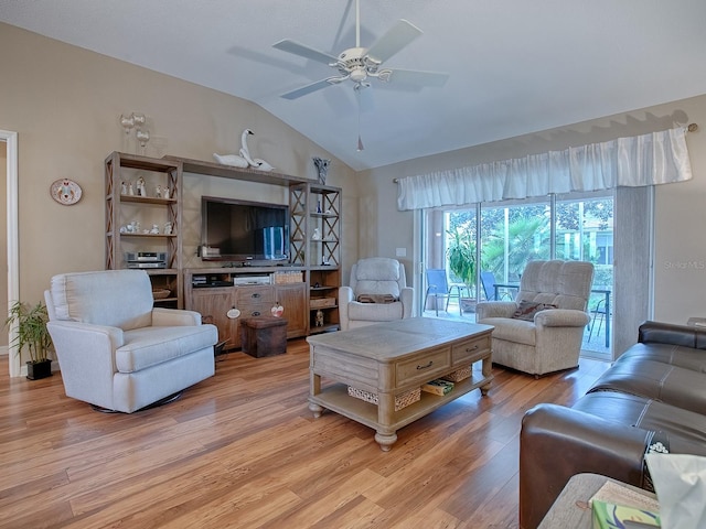 living room featuring ceiling fan, vaulted ceiling, and light hardwood / wood-style flooring