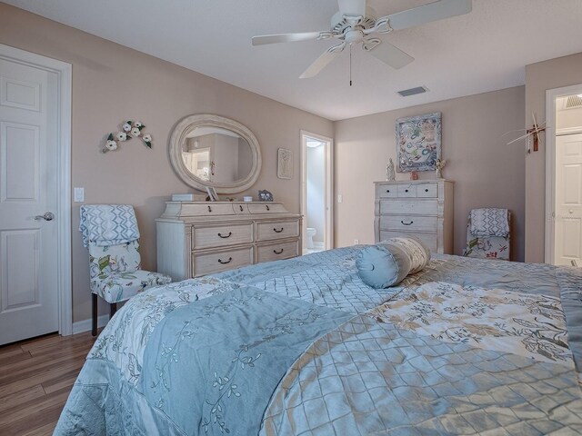 bedroom with ceiling fan and hardwood / wood-style flooring