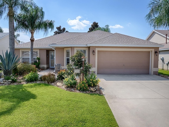 ranch-style house featuring an attached garage, a shingled roof, driveway, stucco siding, and a front yard