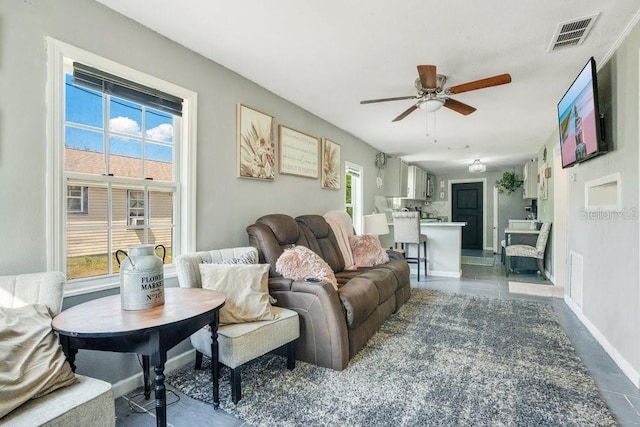 living room featuring ceiling fan