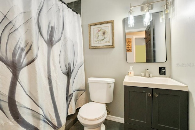 bathroom with vanity and toilet