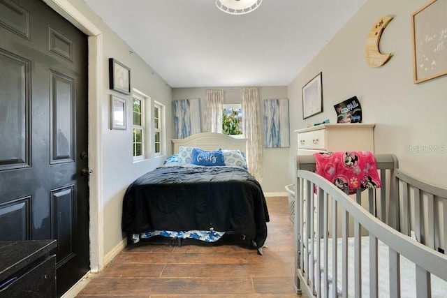 bedroom featuring dark hardwood / wood-style floors