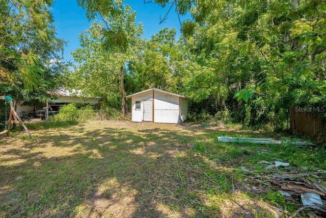 view of yard with a storage shed