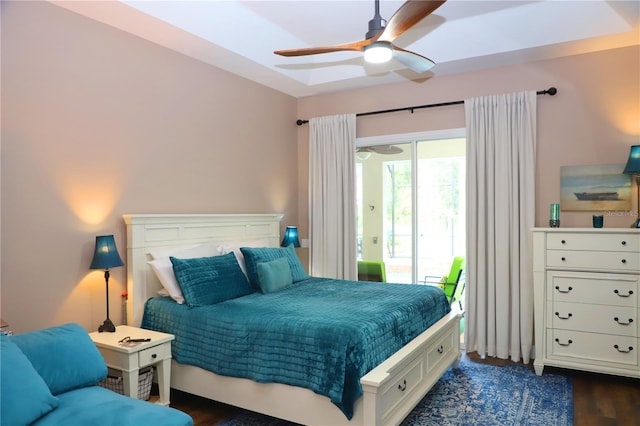 bedroom featuring access to exterior, dark wood-type flooring, and ceiling fan