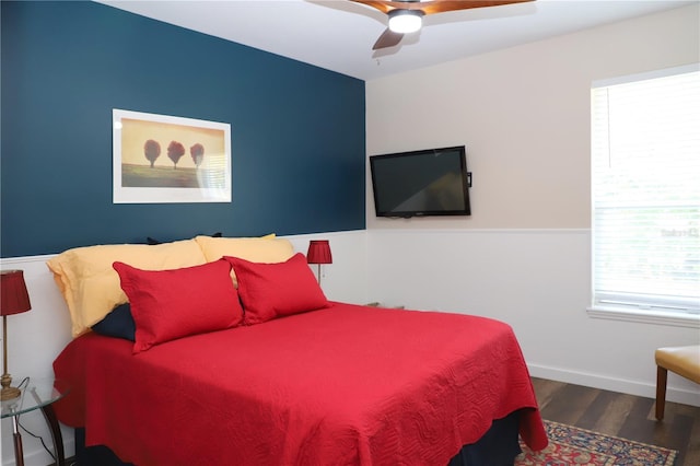 bedroom featuring a ceiling fan and wood finished floors