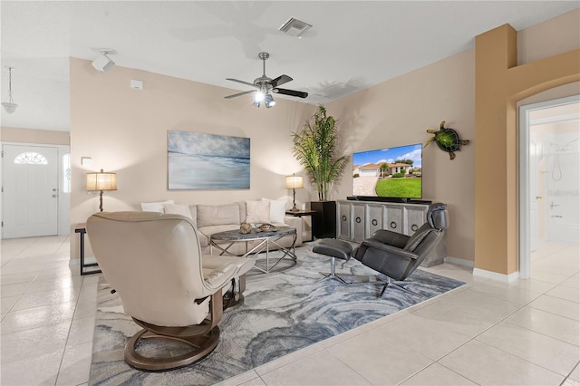 living room featuring ceiling fan and light tile patterned floors