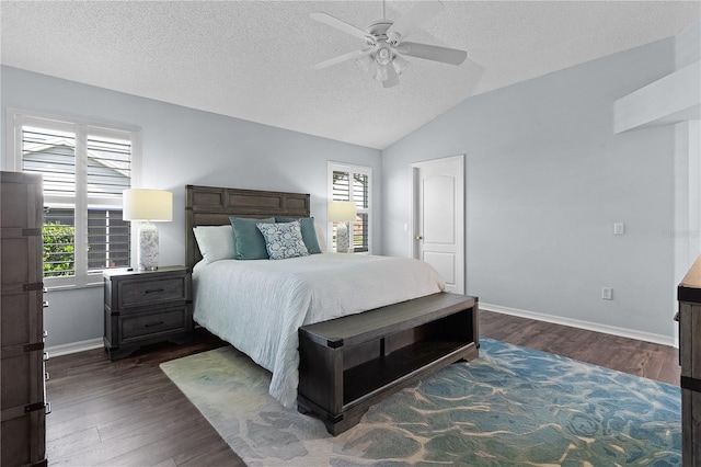 bedroom with ceiling fan, vaulted ceiling, a textured ceiling, and dark hardwood / wood-style flooring