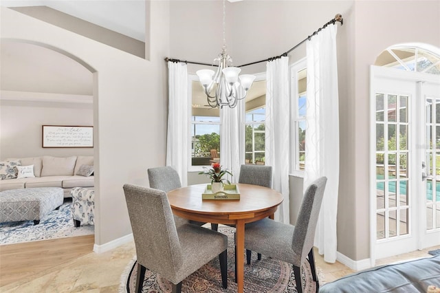 dining area with an inviting chandelier