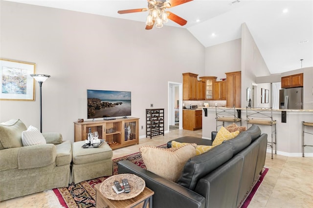 tiled living room with high vaulted ceiling and ceiling fan