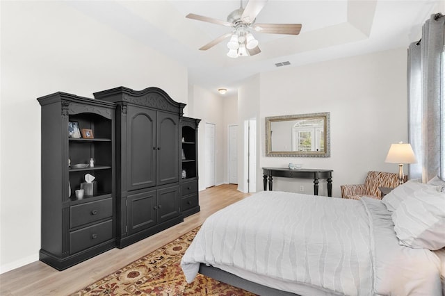 bedroom featuring ceiling fan and light hardwood / wood-style floors