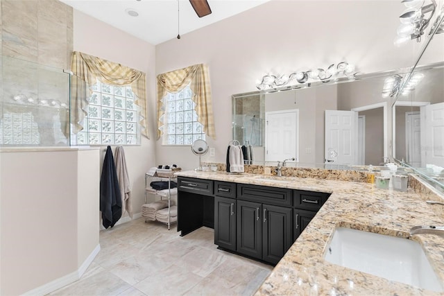 bathroom featuring vanity, ceiling fan, and an enclosed shower